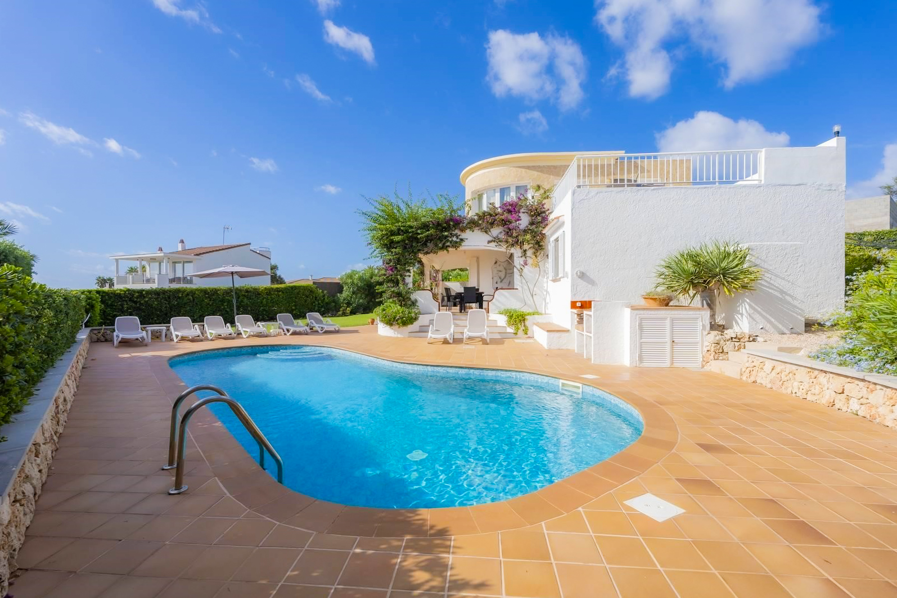 Enjoy the sea views from your private terrace or soak up the sun beside the heated pool at this gorgeous modern villa.