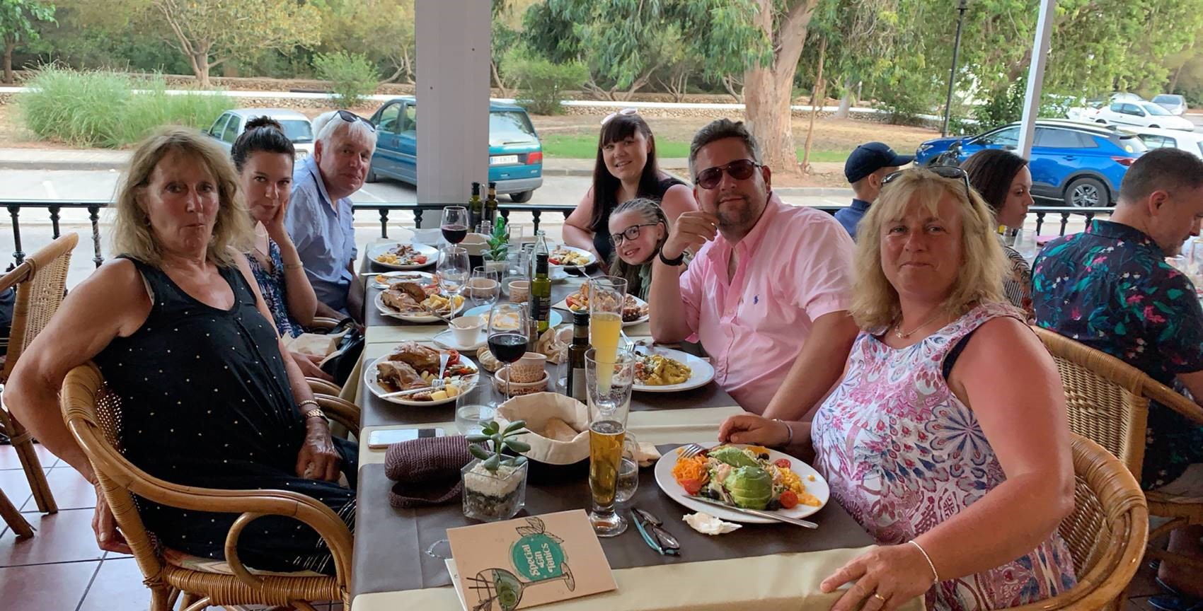 Jonny and his family enjoying a meal out in Menorca