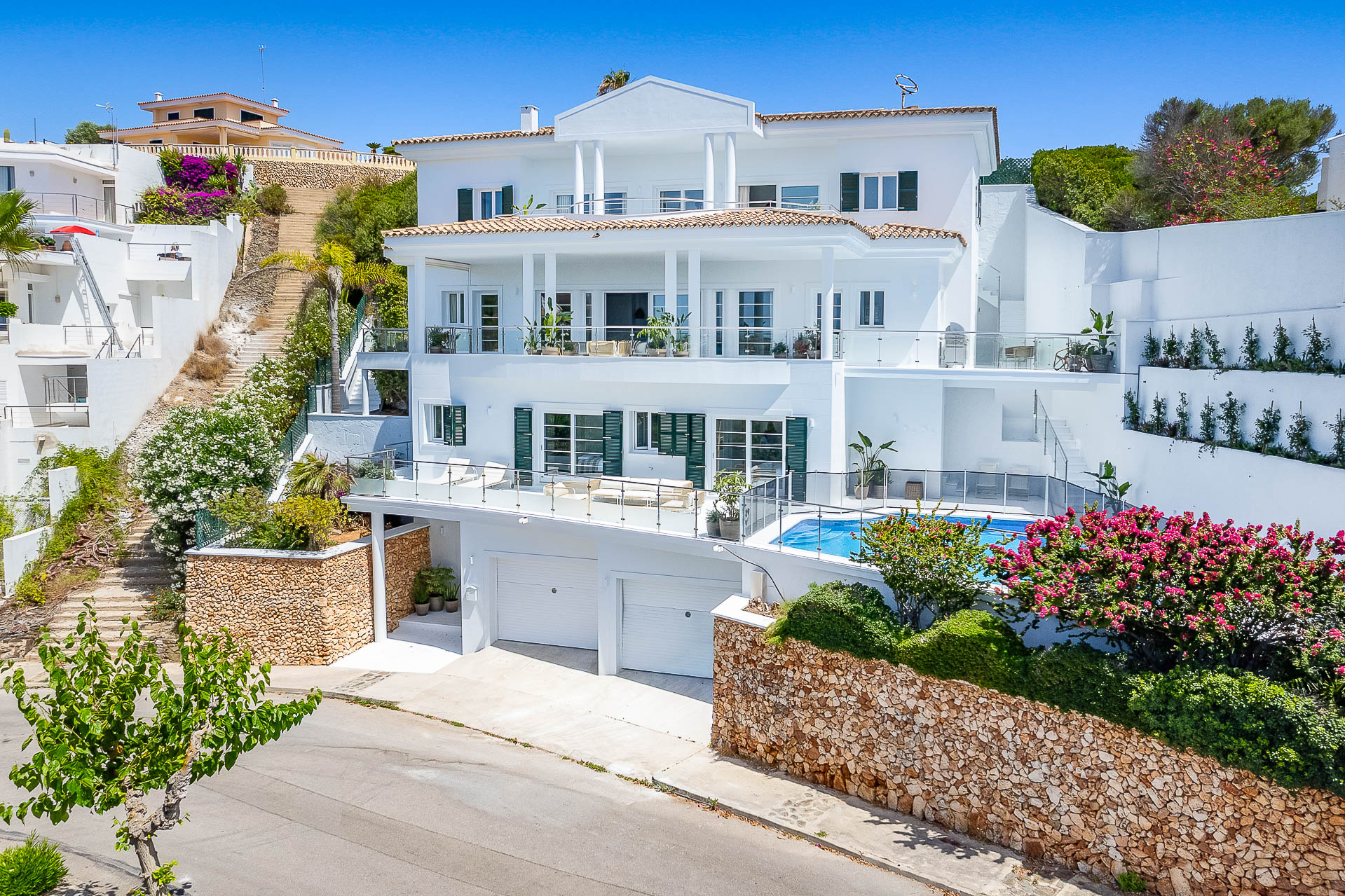 Take in the sea views from your private pool at this gorgeous harbourside villa in the sought-after residential area of Cala Llonga, close to Mahón.