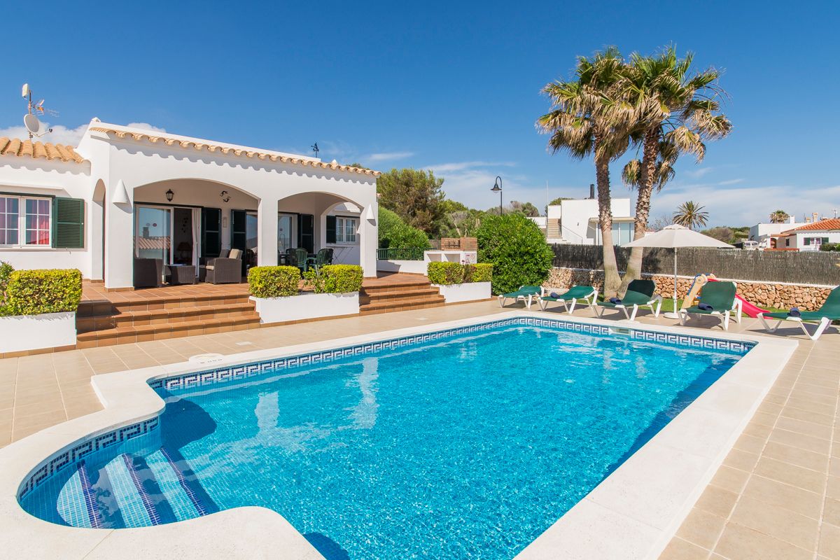 Discover the timeless charm of Can Bequer, a remarkable villa in Binibeca with stunning outdoor spaces and traditional decor.